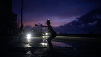 With little else to do during the blackout, residents played frisbee in Havana. Pic: AP