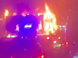 Terrifying moment Tesco lorry goes up in flames on the M25: Major road closed as fire crews battle inferno