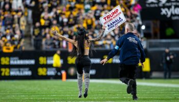 Woman runs onto Steelers' field with pro-Trump sign as former president attends game