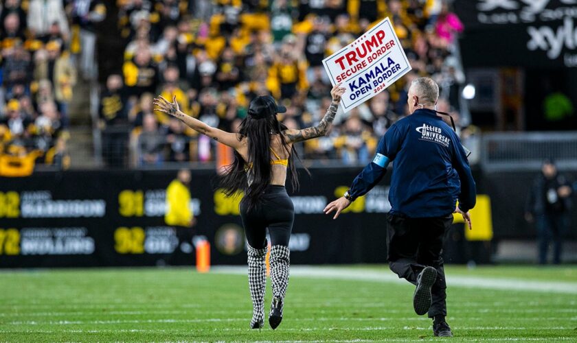 Woman runs onto Steelers' field with pro-Trump sign as former president attends game