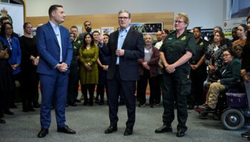 Prime Minister Sir Keir Starmer (centre) and Health Secretary Wes Streeting, with chief paramedic at London Ambulance Service Pauline Cranmer, meet NHS staff during a visit in east London. Picture date: Monday October 21, 2024.