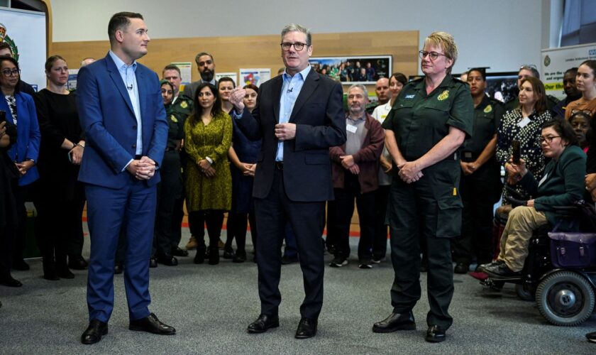 Prime Minister Sir Keir Starmer (centre) and Health Secretary Wes Streeting, with chief paramedic at London Ambulance Service Pauline Cranmer, meet NHS staff during a visit in east London. Picture date: Monday October 21, 2024.