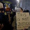 Protestors holding 'Justice for Chris Kaba' signs gather outside the Old Bailey after Met marksman who shot him dead is found not guilty of murder - as police release footage of moment officer opened fire