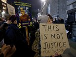 Protestors holding 'Justice for Chris Kaba' signs gather outside the Old Bailey after Met marksman who shot him dead is found not guilty of murder - as police release footage of moment officer opened fire