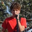 Guess the Hollywood offspring! Son of celebrity chef and actress shows off his singing and guitar skills as he performs at LA beach festival