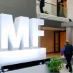 Attendees walk inside an atrium at the 2022 Annual Meetings of the International Monetary Fund and the World Bank Group, Monday, Oct. 10, 2022, in Washington. (AP Photo/Patrick Semansky)