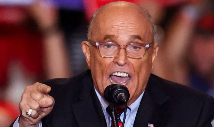 FILE PHOTO: Former mayor of New York City and former Trump lawyer Rudy Giuliani speaks at the Nassau Veterans Memorial Coliseum during a rally held by Republican presidential nominees and former U.S. President Donald Trump, in Uniondale, New York, U.S., September 18, 2024. REUTERS/Brendan McDermid/File Photo