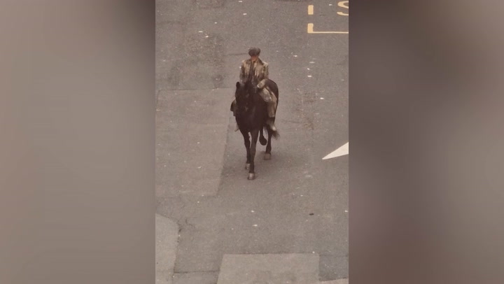 First look at Peaky Blinders film as Cillian Murphy rides horse through Birmingham