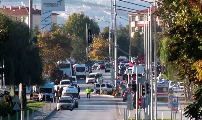 Emergency teams and police outside Turkish Aerospace in Ankara. Pic: AP