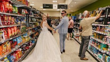 Food and marriage? Newlyweds snap wedding pix in grocery-store aisle