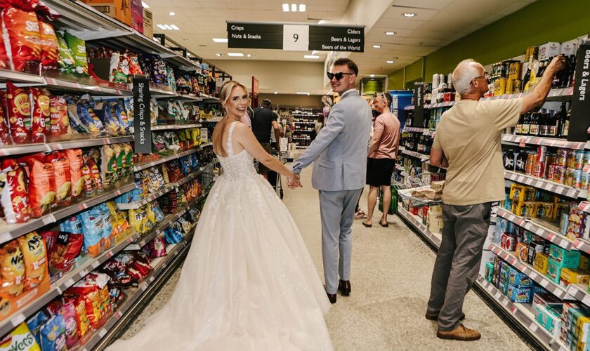 Food and marriage? Newlyweds snap wedding pix in grocery-store aisle