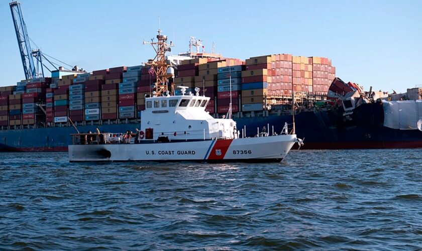 This image provided by the U.S. Coast Guard shows the U.S. Coast Guard Cutter Sailfish, an 87-foot Marine Protector class vessel, as it prepares to escort the Motor Vessel Dali during its transit from the Port of Baltimore to the Port of Virginia, Monday, June 24, 2024. (Petty Officer 3rd Class Christopher Bokum/U.S. Coast Guard via AP)