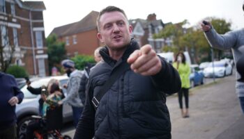 Tommy Robinson charged after handing himself in at police station