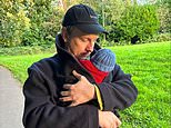 Joe Lycett reveals he's become a father as he shares sweet snap of him cradling newborn son - days after confirming secret girlfriend