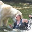 Moments from being ripped to pieces by polar bears... during trip to the zoo: Woman's miracle survival after jumping in 'to swim' with the deadly animals, sparking desperate rescue as beast gnawed on her