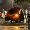 Car left dangling from traffic signs on roundabout after horror crash