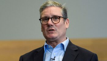 Britain's Prime Minister Keir Starmer gestures during his visit to a NHS Healthcare Facility in East London, Monday Oct. 21, 2024. (Jaimi Joy/Pool Photo via AP)