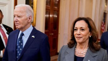 U.S. President Joe Biden and Democratic presidential nominee Vice President Kamala Harris walk to deliver remarks on gun violence in America, at the White House in Washington, U.S., September 26, 2024. REUTERS/Elizabeth Frantz