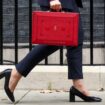 Britain's Chancellor of the Exchequer Rachel Reeves walks with the red budget box outside her office on Downing Street in London, Britain October 30, 2024. REUTERS/Mina Kim