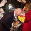 Joe Biden bites baby's leg and sticks tot's foot in his mouth as kids come dressed for Halloween