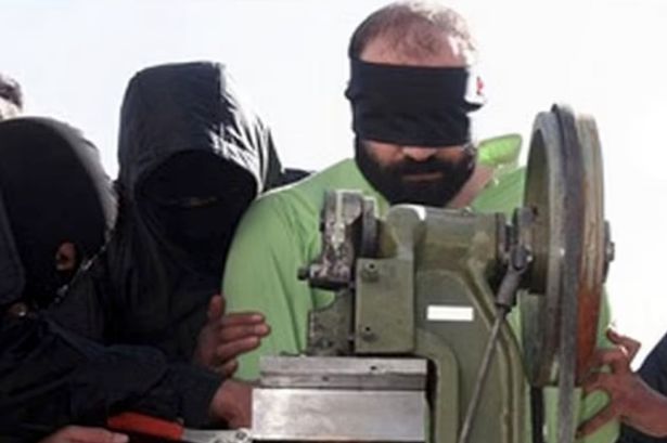 Iran amputates four fingers of two thieves with guillotine machine in rare Sharia law punishment