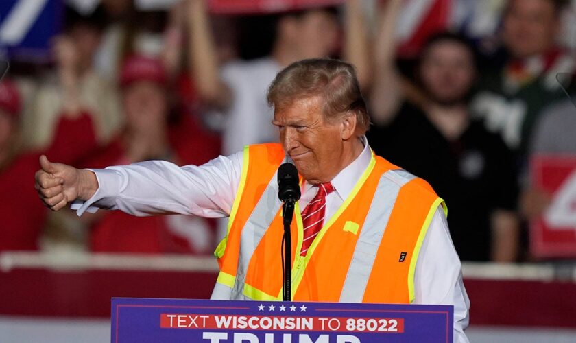 Donald Trump wears garbage worker vest to rally in critical swing state