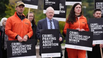 John Mason MSP joins people as they take part in a protest outside the Scottish Parliament in Edinburgh as new laws come into force across Scotland, preventing anti-abortion protesters from gathering within 200 metres of facilities where abortions are carried out. Safe access zones are in pace at 30 health facilities around Scotland. Picture date: Tuesday September 24, 2024.