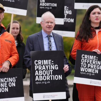 John Mason MSP joins people as they take part in a protest outside the Scottish Parliament in Edinburgh as new laws come into force across Scotland, preventing anti-abortion protesters from gathering within 200 metres of facilities where abortions are carried out. Safe access zones are in pace at 30 health facilities around Scotland. Picture date: Tuesday September 24, 2024.