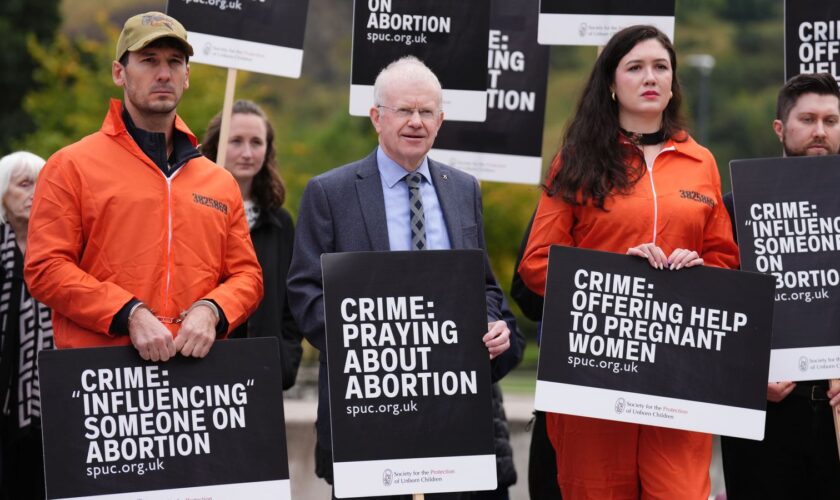 John Mason MSP joins people as they take part in a protest outside the Scottish Parliament in Edinburgh as new laws come into force across Scotland, preventing anti-abortion protesters from gathering within 200 metres of facilities where abortions are carried out. Safe access zones are in pace at 30 health facilities around Scotland. Picture date: Tuesday September 24, 2024.