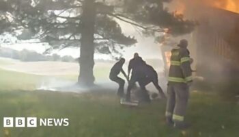 Bodycam captures rescue of woman in basement of burning house