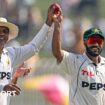 Pakistan spinners Noman Ali (left) and Sajid Khan (right) hold up the ball together as they walk off after dismissing England