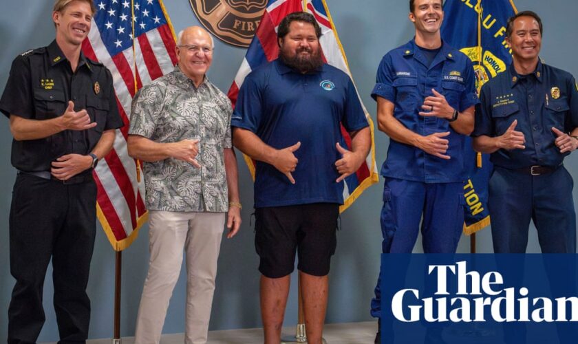 Hawaii teenager rescued after spending night clinging to kayak in ocean