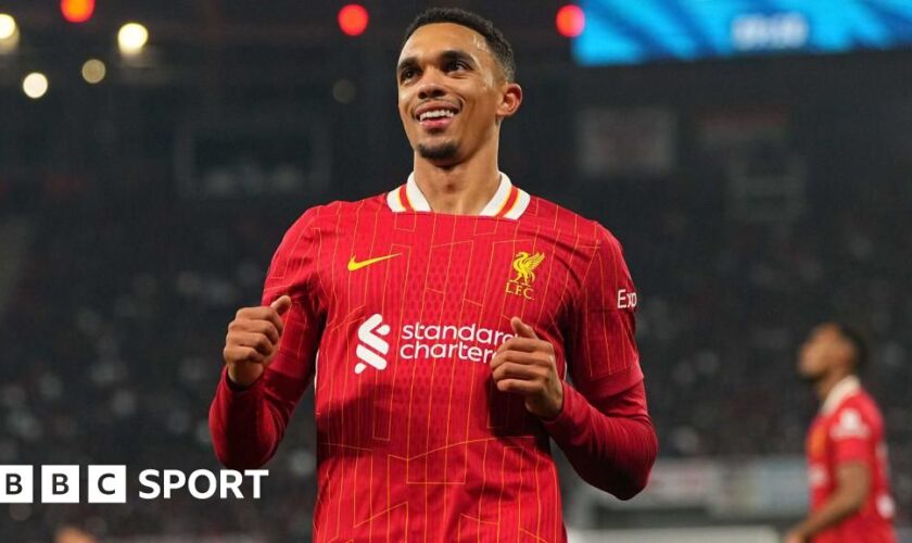 Trent Alexander-Arnold smiling while running on the pitch