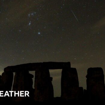 A meteor streaks in the skies above Stonehenge