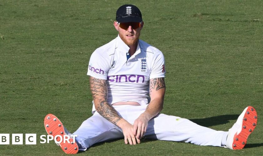 Ben Stokes sits on the pitch