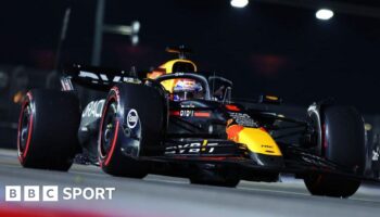 A front view looking up at Max Verstappen driving his Red Bull during the Singapore Grand Prix