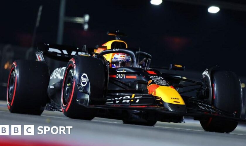 A front view looking up at Max Verstappen driving his Red Bull during the Singapore Grand Prix