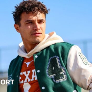 Lando Norris wearing a green and white bomber jacket at the Circuit of the Americas before the United States Grand Prix weekend