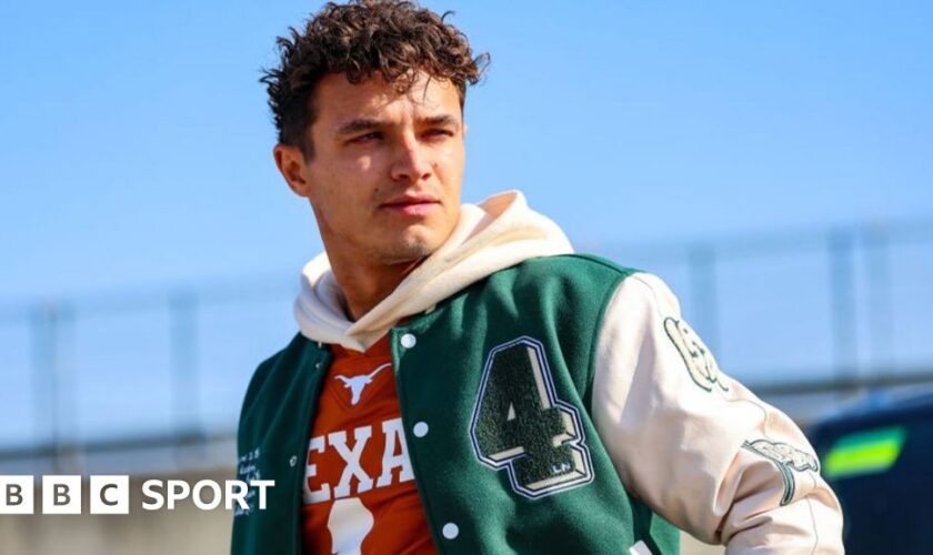 Lando Norris wearing a green and white bomber jacket at the Circuit of the Americas before the United States Grand Prix weekend