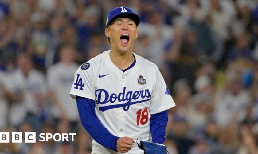 Los Angeles Dodgers pitcher Yoshinobu Yamamoto celebrates