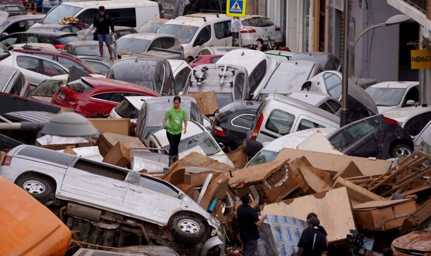 Vehicles are seen piled up after being swept away by floods in Valencia, Spain, Thursday, Oct. 31, 2024. (AP Photo/Alberto Saiz)