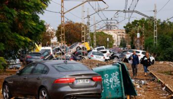 Abandoned cars pile up on railway tracks after flooding in Alfafar, Valencia. Pic: Reuters