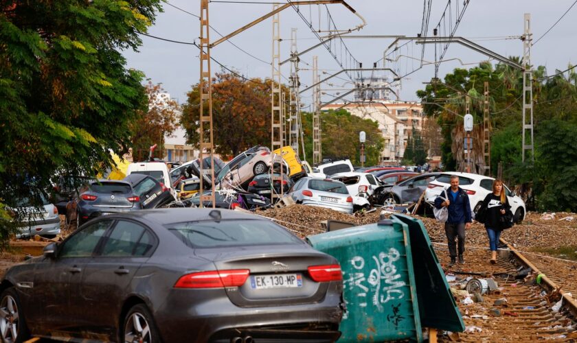 Abandoned cars pile up on railway tracks after flooding in Alfafar, Valencia. Pic: Reuters