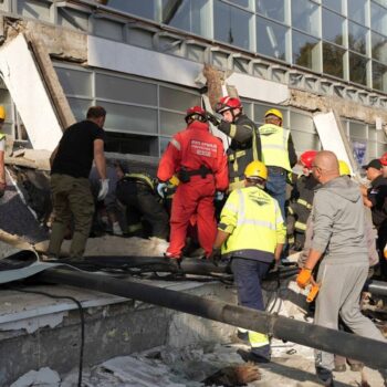 Rescue service workers at the scene of the roof collapse. Pic: AP