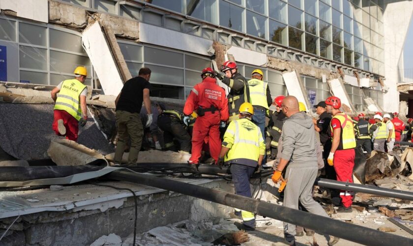 Rescue service workers at the scene of the roof collapse. Pic: AP