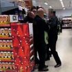 Moment Asda 'security guard punches and slaps customer as he is held down by two workers'