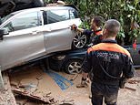 Valencia flood miracle as woman is found alive after being trapped with her dead sister-in-law for THREE days in their car - as rescue teams continue grim hunt for victims of deadly mega storm