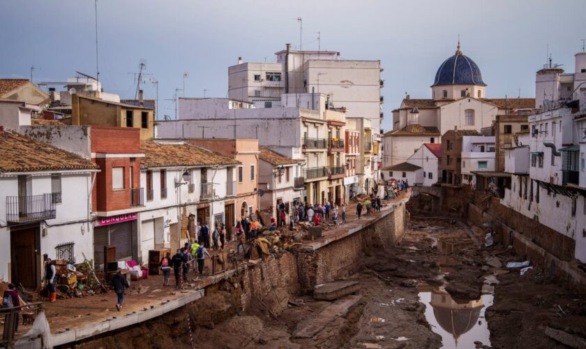 Crashing waves in a hilltop village, a night of terror from Spain's floods