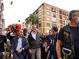 King Felipe is heckled and has mud thrown at him by furious locals during visit to flood-hit Valencia - as rescuers continue desperate search for thousands still missing