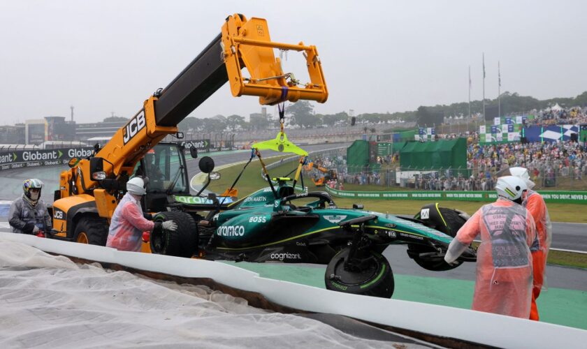 Aston Martin's Fernando Alonso car is towed away after crashing out during qualifying. Pic: Reuters